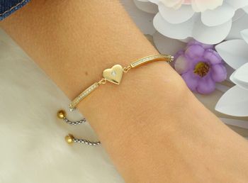 Stylowa bransoletka damska Nomination Italy Milleluci z zawieszką w kształcie serca 028018 022. Stal szlachetna platerowana złotem, wysadzana cyrkoniami, regulowana długość 14–19 cm. Idealny preze.jpg